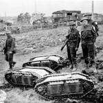 British soldiers with captured German Goliath tracked mines.