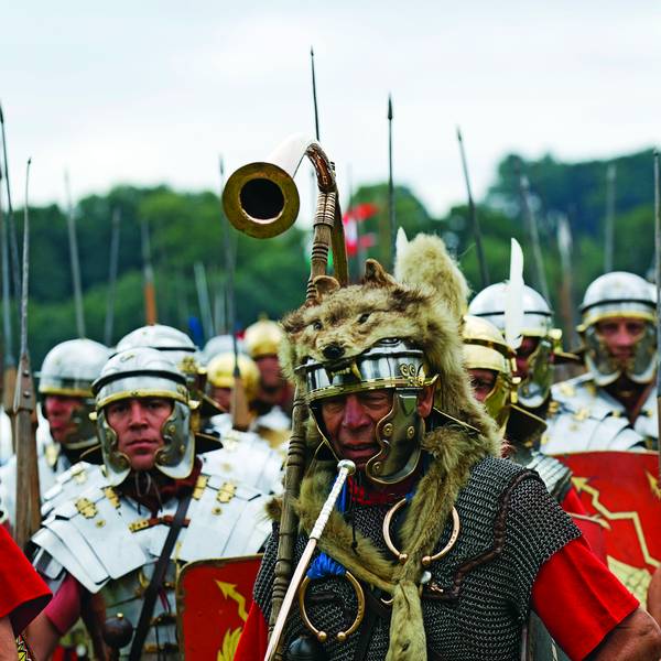 Full Roman Century on the march with infantrymen. horn-blower, standard bearer, centuruion (sergeant major) and equipment. Image shot 2010. Exact date unknown.